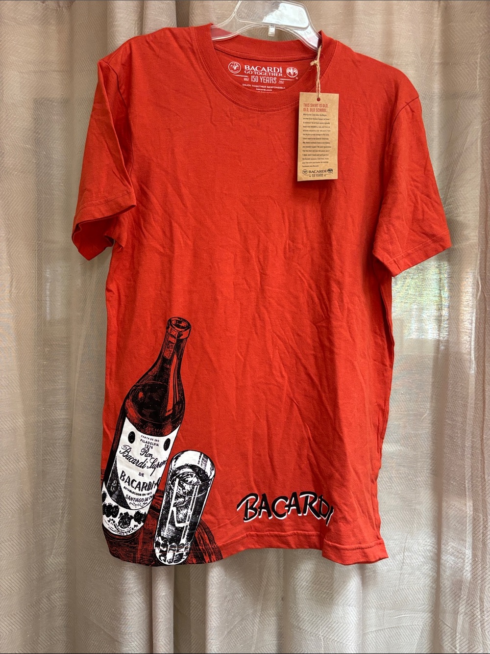 Men’s burnt orange Graphic Tee NWT MD.  BACARDI BRAND. Go together 150 yrs